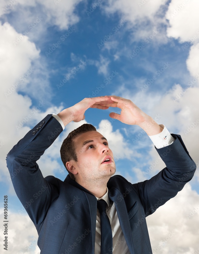 Poster composite image of businessman standing with hands over head