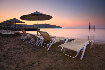 Umbrellas on the beach, Crete, Greece.