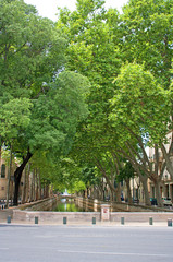 Canal of water leading to a fountain and gardens