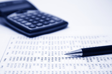 Financial accounting. Pen, calculator and calculation sheet