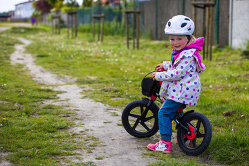 Fototapeta premium Infant preschool girl playing outdoor