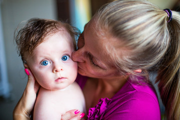 Mother holding newborn girl