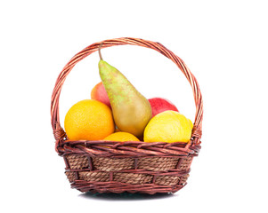 Wicker basket full of juicy fruits.