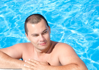 Young man in the swimming pool
