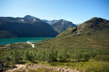 Fototapeta na wymiar Hikers taking route through ridge at Bessegen, Norway