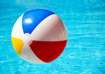 Beach ball in swimming pool