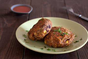 Delicious vegetable bean burgers with herbs and tomato sauce