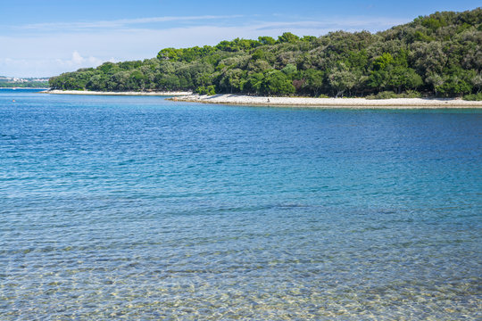 Small island with deep blue sea
