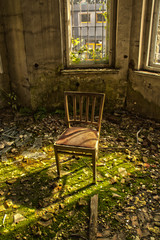 Old chair in an abandoned dilapidated house 2