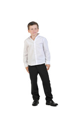a little boy 7 years old, in a white shirt and black pants with