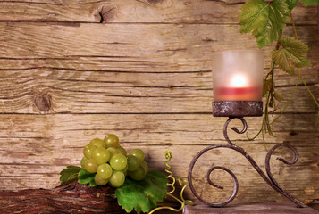 Candle holder with vine leaves and grapes