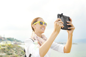 Tourist photographing at beach