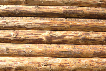 The walls of a house from planed horizontal logs as background