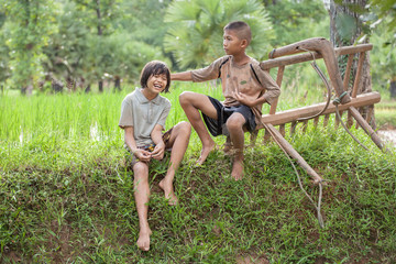 Fototapeta premium Little boy and girl farmer on green fields.