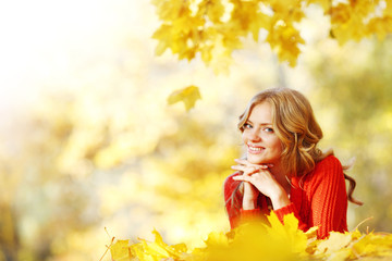 Woman laying in autumn park