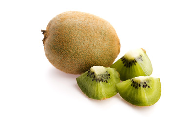 Whole kiwi fruit and his sliced segments isolated on white backg