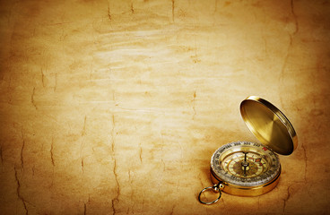 Compass on vintage old paper background