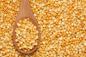 Split yellow peas in a wooden spoon