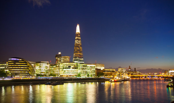 Shard of glass in night lights, view from the Tower bridge