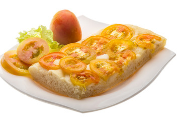 Pizza with sliced tomato