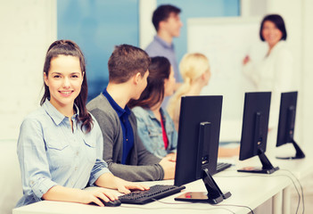 Obraz premium students with computer monitor at school