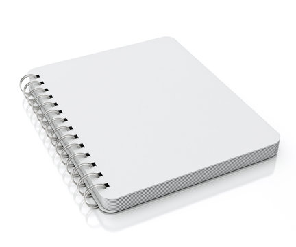 empty spiral notebook lying isolated on white background