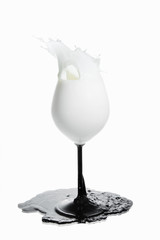 splas milk in wine glass - 69396685
