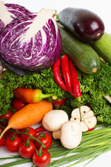 decorative pattern of fresh vegetables on white background