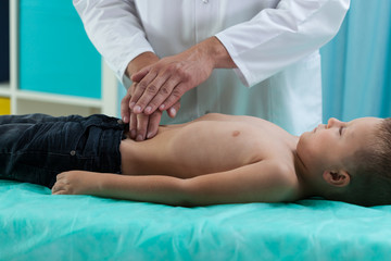 Little boy during stomach examination