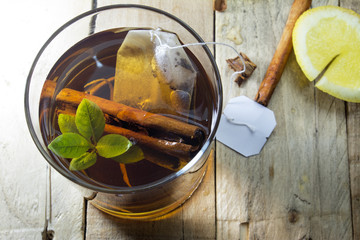 Cup of Healthy Tea over wood background