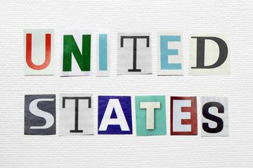 United States text cut from newspaper on white paper
