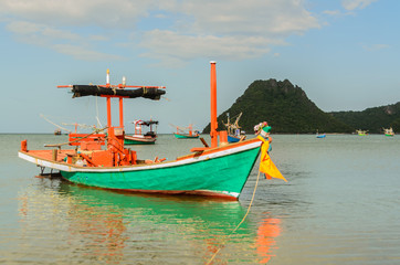 Naklejka na ściany i meble Small fishing boats in the beach