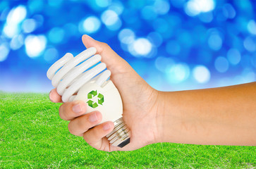 Hand with lamp and sign recycle