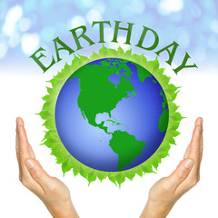 hands and globe on leaves and wording Earthday
