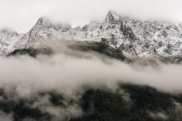 Fototapeta na wymiar alpine peaks obscured by cloud inversion