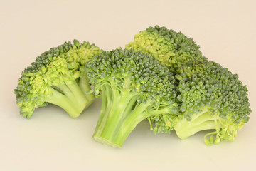 Fresh cut raw Broccoli on creamy background