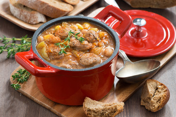 delicious vegetable stew with sausages in a pan