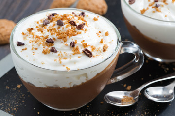 dessert with chocolate, cream and amaretti in glass cups