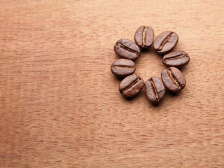 Coffee crop beans with text paper on wood texture