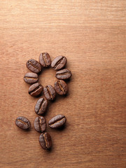 Coffee crop beans on wood texture
