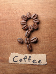 Coffee crop beans with text paper on wood texture
