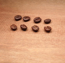 Coffee crop beans on wood texture