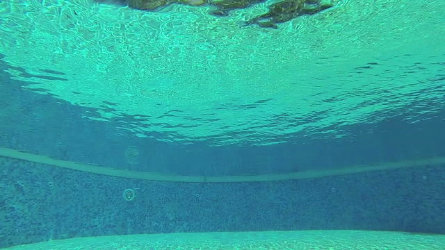 Man jumping in the swimming pool, steadycam, slow motion 120fps