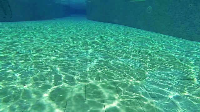 Camera jumping into the swimming pool,  slow motion 120fps