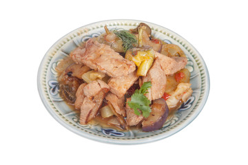 meat stew with vegetables and herbs in a bowl isolated on white