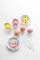 Yellow cake pops isolated on white background