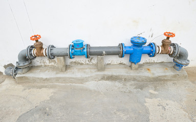 water supply valve on cement floor