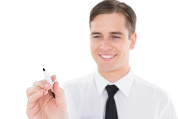Nerdy businessman writing with black marker