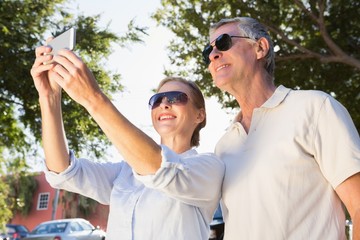 Happy senior couple posing for a selfie