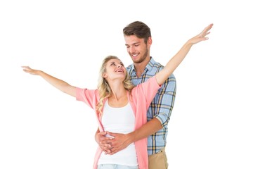 Fototapeta premium Attractive young couple smiling and embracing
